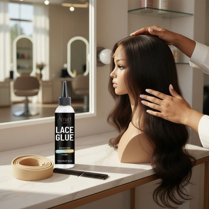 Amari Magic Glow Lace Glue 150ml bottle with extreme hold, waterproof, and invisible properties on a vanity.