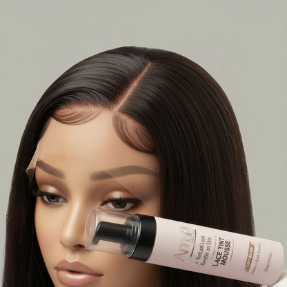 Amari Magic Glow Lace Tint Mousse in Light Brown, 100ml bottle held by a mannequin with a wig.